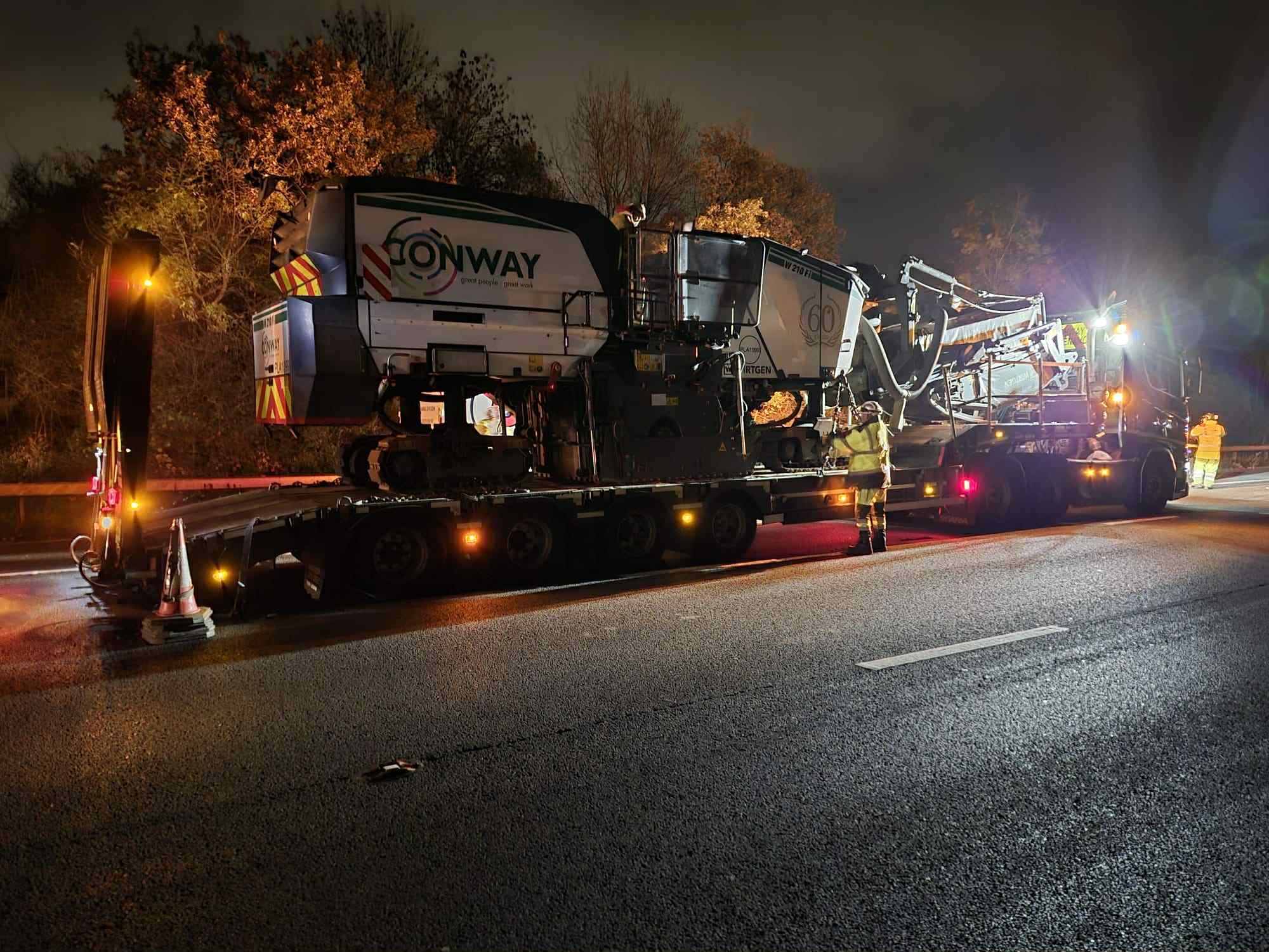 Road planer loaded onto a haulage lorry